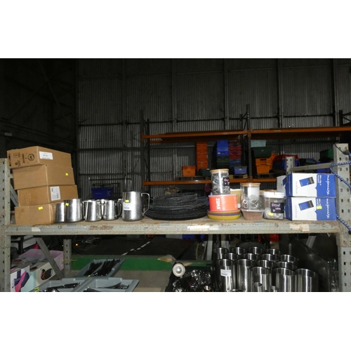 1084 - A quantity of various stainless steel milk jugs, trays, storage containers etc. Contents of one shel... 