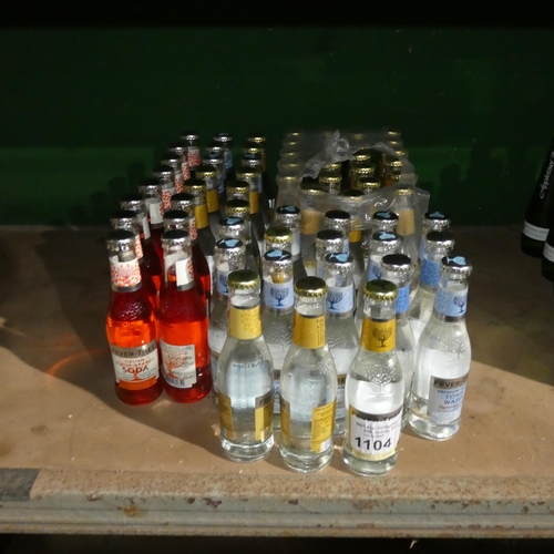 1104 - A quantity of various bottles of tonic water and flavoured soda