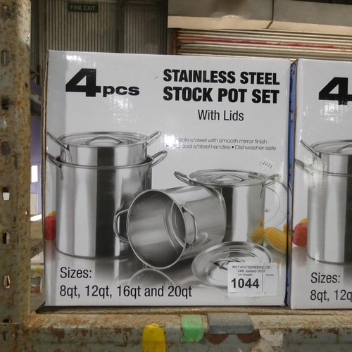 1044 - A unused 4 piece stainless steel pot set with lids, boxed