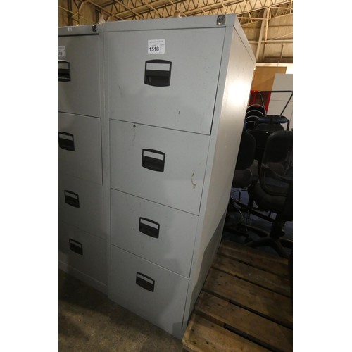 1518 - A grey metal four drawer filing cabinet