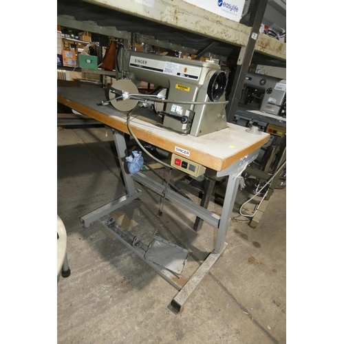 2084 - A Singer 591 industrial sewing machine 240v fitted with a Singer  AS-4002 motor, mounted on an indus... 