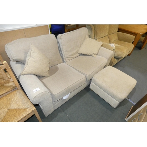 2164 - A light upholstered sofa bed, overall approx 180 cm wide and a matching foot stool