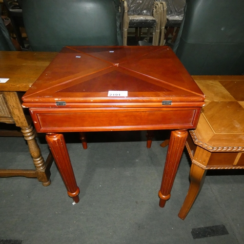 2191 - A dark wood card table with 4-way fold over top approx 60cm square and 85cm square when leafs folded... 