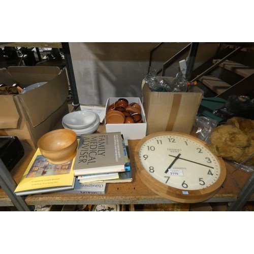 2115 - A quantity of various household items including a wall clock, books, crockery, glassware etc. Conten... 