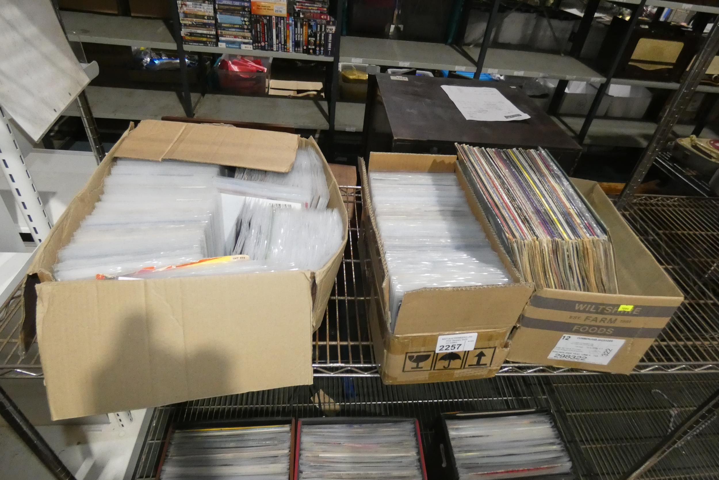3 boxes containing a quantity of various vinyl records. Contents of 1 shelf