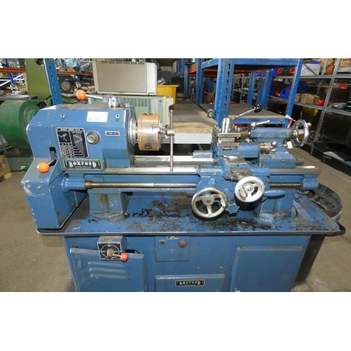 5356 - A Boxford metal turning lathe on cabinet, 3ph, bed length approx 65cm, supplied with a three jaw chu... 