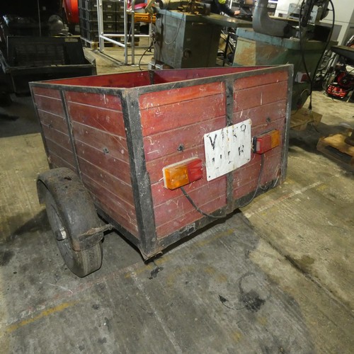 5751 - A small single axle un-braked trailer, body size approx 92cm w x 122cm l and sides are approx 60cm h... 