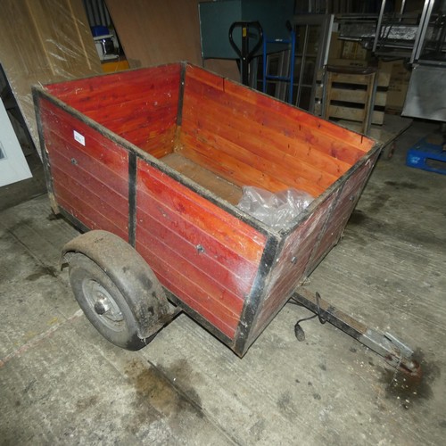 5751 - A small single axle un-braked trailer, body size approx 92cm w x 122cm l and sides are approx 60cm h... 