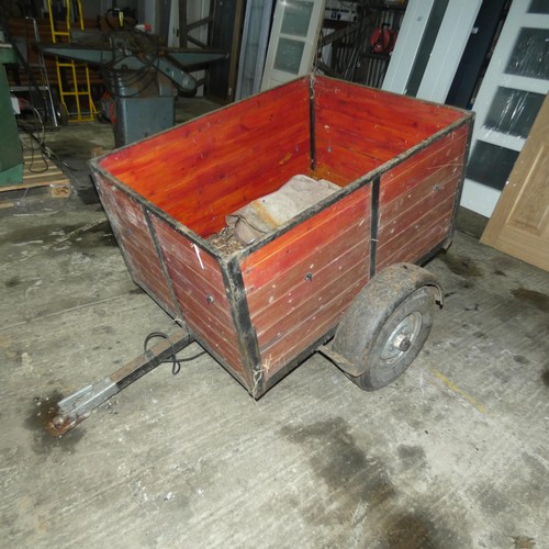 5751 - A small single axle un-braked trailer, body size approx 92cm w x 122cm l and sides are approx 60cm h... 