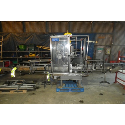 5756 - A large industrial bottling machine with many stainless steel parts believed to be by Filler Sales a... 