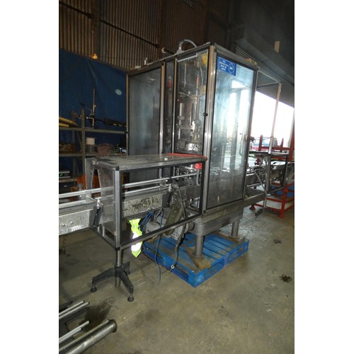 5756 - A large industrial bottling machine with many stainless steel parts believed to be by Filler Sales a... 