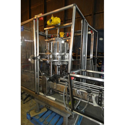 5756 - A large industrial bottling machine with many stainless steel parts believed to be by Filler Sales a... 