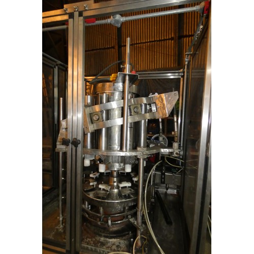 5757 - A large industrial bottling machine with many stainless steel parts by Filler Sales and Service, Dun... 