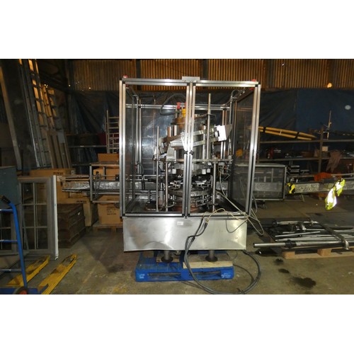 5757 - A large industrial bottling machine with many stainless steel parts by Filler Sales and Service, Dun... 