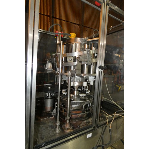 5757 - A large industrial bottling machine with many stainless steel parts by Filler Sales and Service, Dun... 