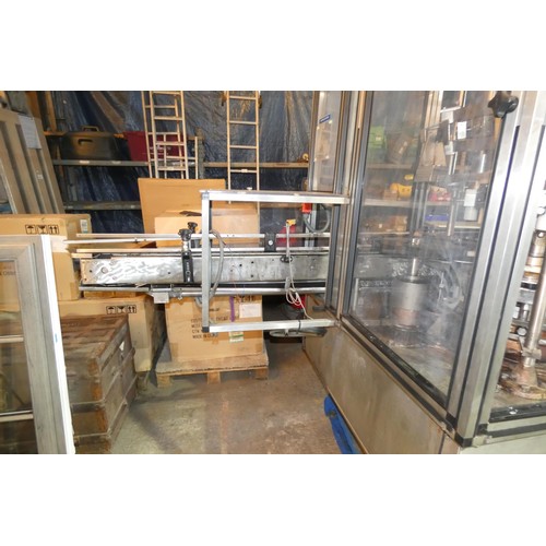 5757 - A large industrial bottling machine with many stainless steel parts by Filler Sales and Service, Dun... 