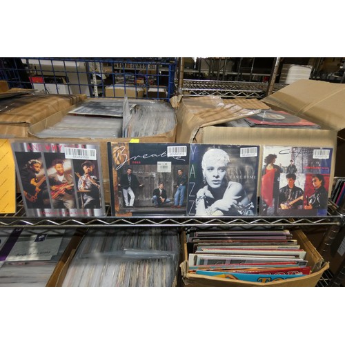 2240 - 4 boxes containing a quantity of various vinyl records - mainly 7 inch singles. Contents of 1 shelf