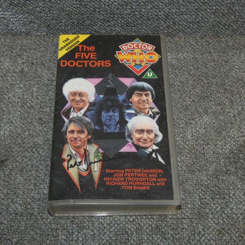 676 - A vhs cassette of Doctor Who - the Five Doctors signed by Peter Davison