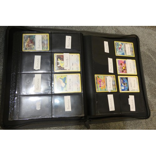 691 - A quantity of various Pokémon collectible items inc Trading cards, posters, ultimate guard folder wi... 