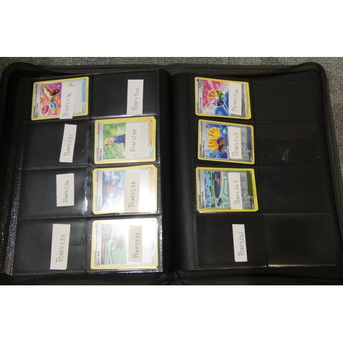 691 - A quantity of various Pokémon collectible items inc Trading cards, posters, ultimate guard folder wi... 