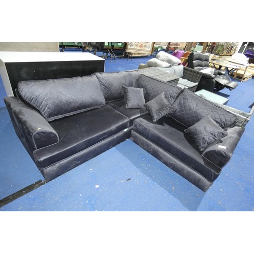 1388 - A black upholstered corner sofa approx 200 x 200cm. Please note that this sofa is missing the legs /... 