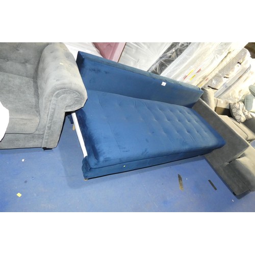 1384 - A blue upholstered sofa bed approx 200cm wide. Please note that this sofa bed is missing both the en... 