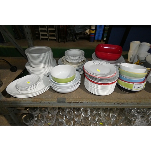 2055 - A quantity of various crockery including bowls plates etc. Contents of 1/2 a shelf