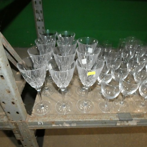 2057 - A quantity of various drinking glasses, water jugs etc. Contents of 1 shelf