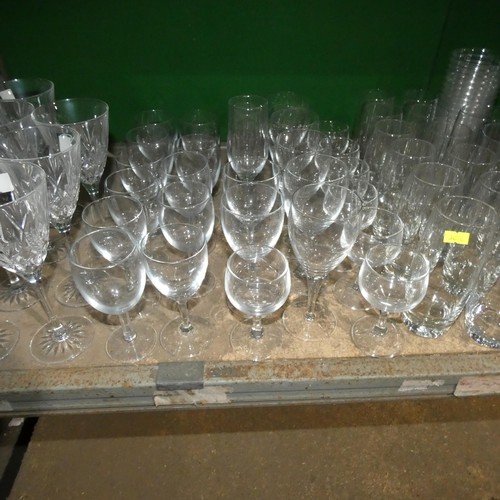 2057 - A quantity of various drinking glasses, water jugs etc. Contents of 1 shelf