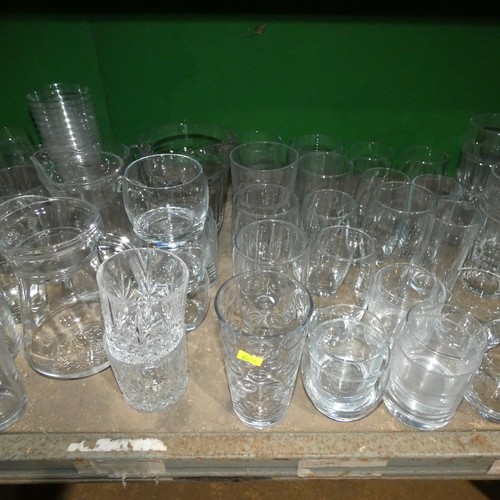 2057 - A quantity of various drinking glasses, water jugs etc. Contents of 1 shelf