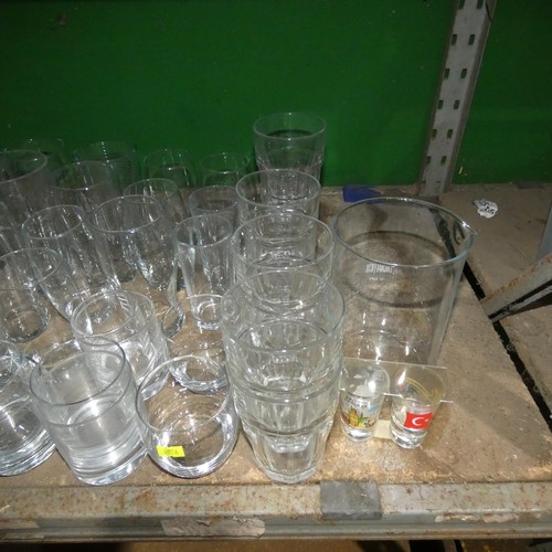 2057 - A quantity of various drinking glasses, water jugs etc. Contents of 1 shelf