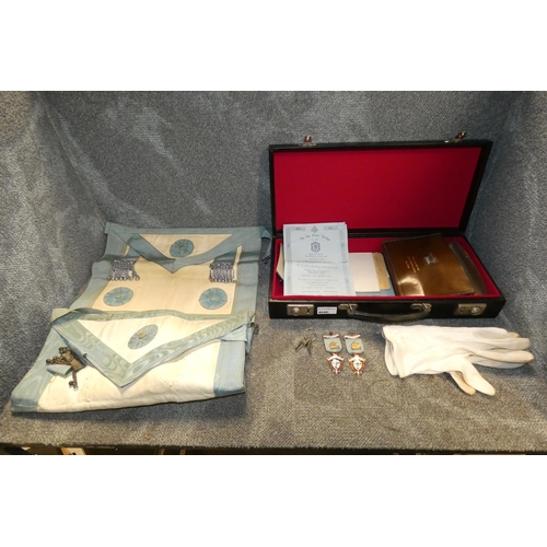 4040 - A small black attache case containing Masonic regalia