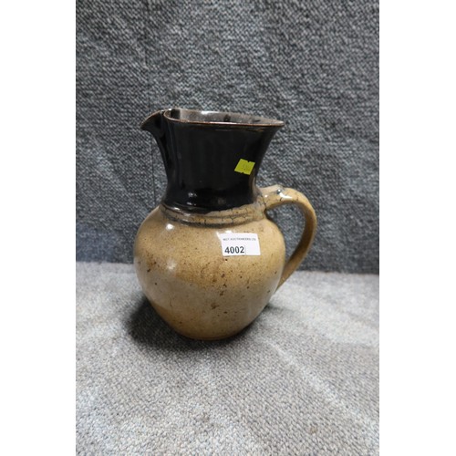 4002 - A decorative stoneware jug, a metalwork fish ornament and a two handled basket