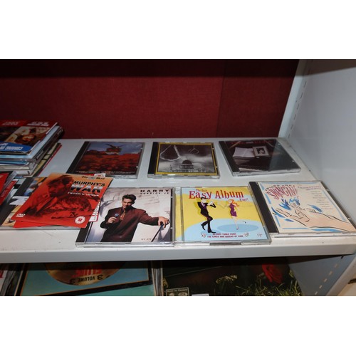 4006 - A quantity of miscellaneous DVDs & CDs (one shelf)