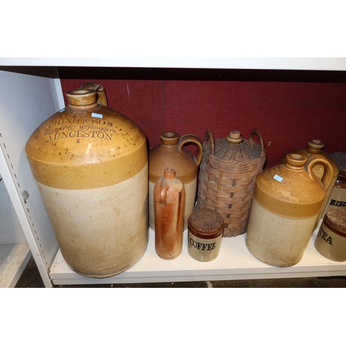 4023 - A large stoneware jar and a large quantity of other smaller stoneware jars, bottles and hot water bo... 