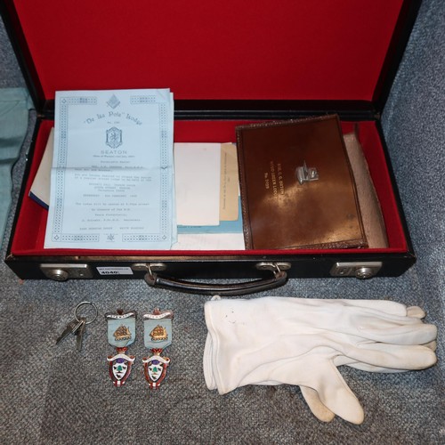 4040 - A small black attache case containing Masonic regalia