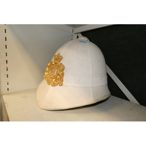 4044 - A retro German style military helmet and a retro pith helmet