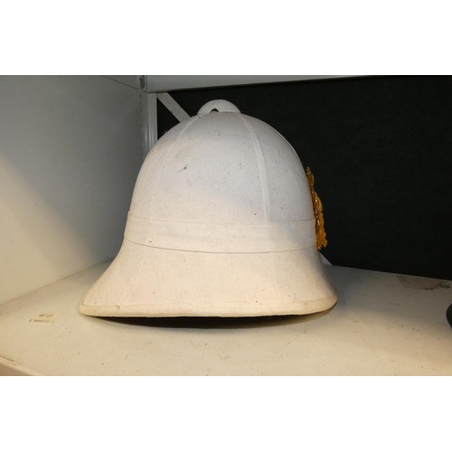 4044 - A retro German style military helmet and a retro pith helmet