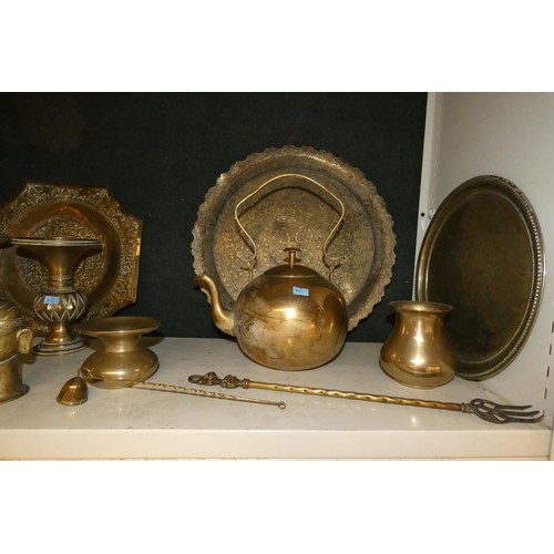 4048 - A large brass kettle, various large brass trays and a quantity of miscellaneous decorative brass war... 