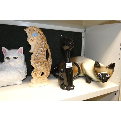 4056 - A quantity of miscellaneous decorative ceramic cat, dog and other animal ornaments (2 shelves)