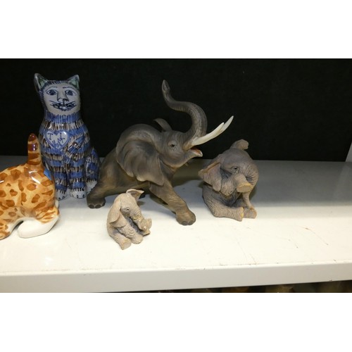 4056 - A quantity of miscellaneous decorative ceramic cat, dog and other animal ornaments (2 shelves)