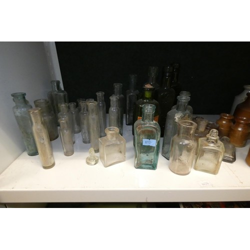 4057 - A quantity of small stoneware bottles and vintage glass bottles (one shelf)