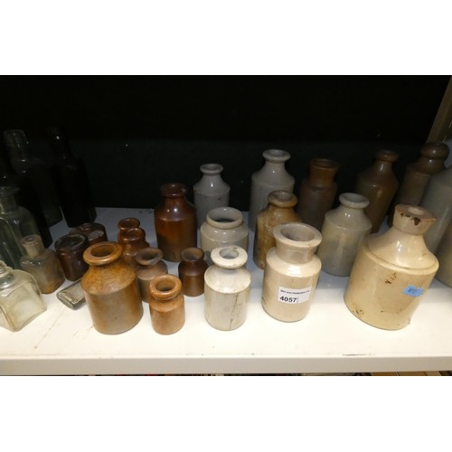 4057 - A quantity of small stoneware bottles and vintage glass bottles (one shelf)