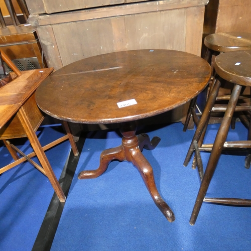 An early circular topped tipup pedestal table on tripod base