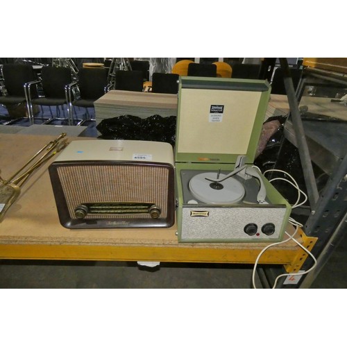 A vintage Dansette portable record player and a vintage HMV mains radio