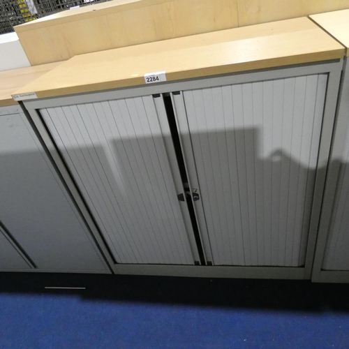 2284 - A grey metal tambour front storage cabinet with wood effect top approx 100 x 49 x 104cm high