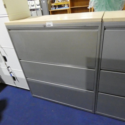 2294 - A silver metal 3 drawer lateral filing cabinet with wood effect top approx 100 x 47 x 118cm high