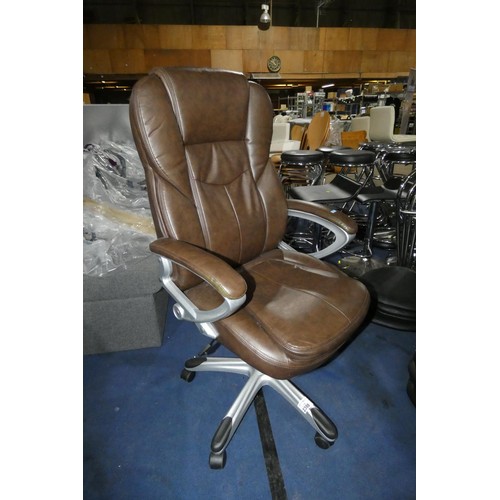 2308 - A brown upholstered office swivel chair