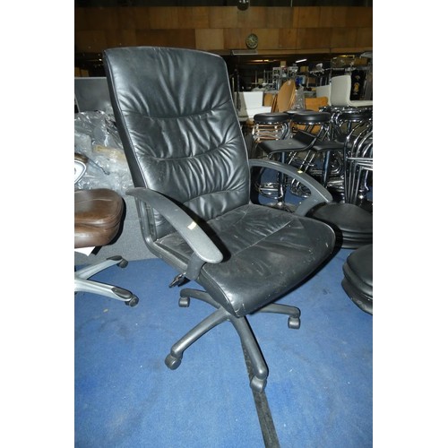 2309 - A black faux leather upholstered office swivel chair