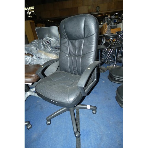 2310 - A black faux leather upholstered office swivel chair